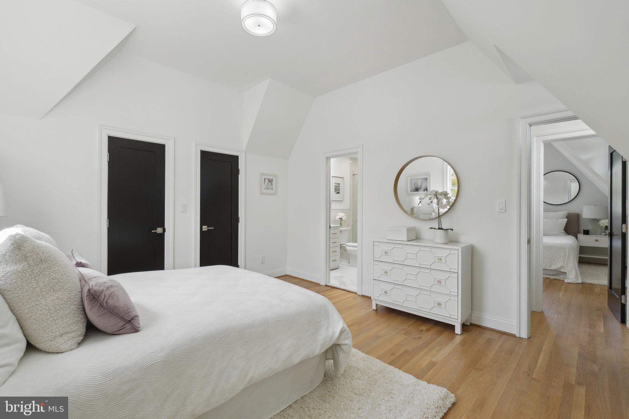 4423 Volta Place Northwest Washington, DC 20007 - Photo 20 of 36 a bedroom with a bed and a dresser
