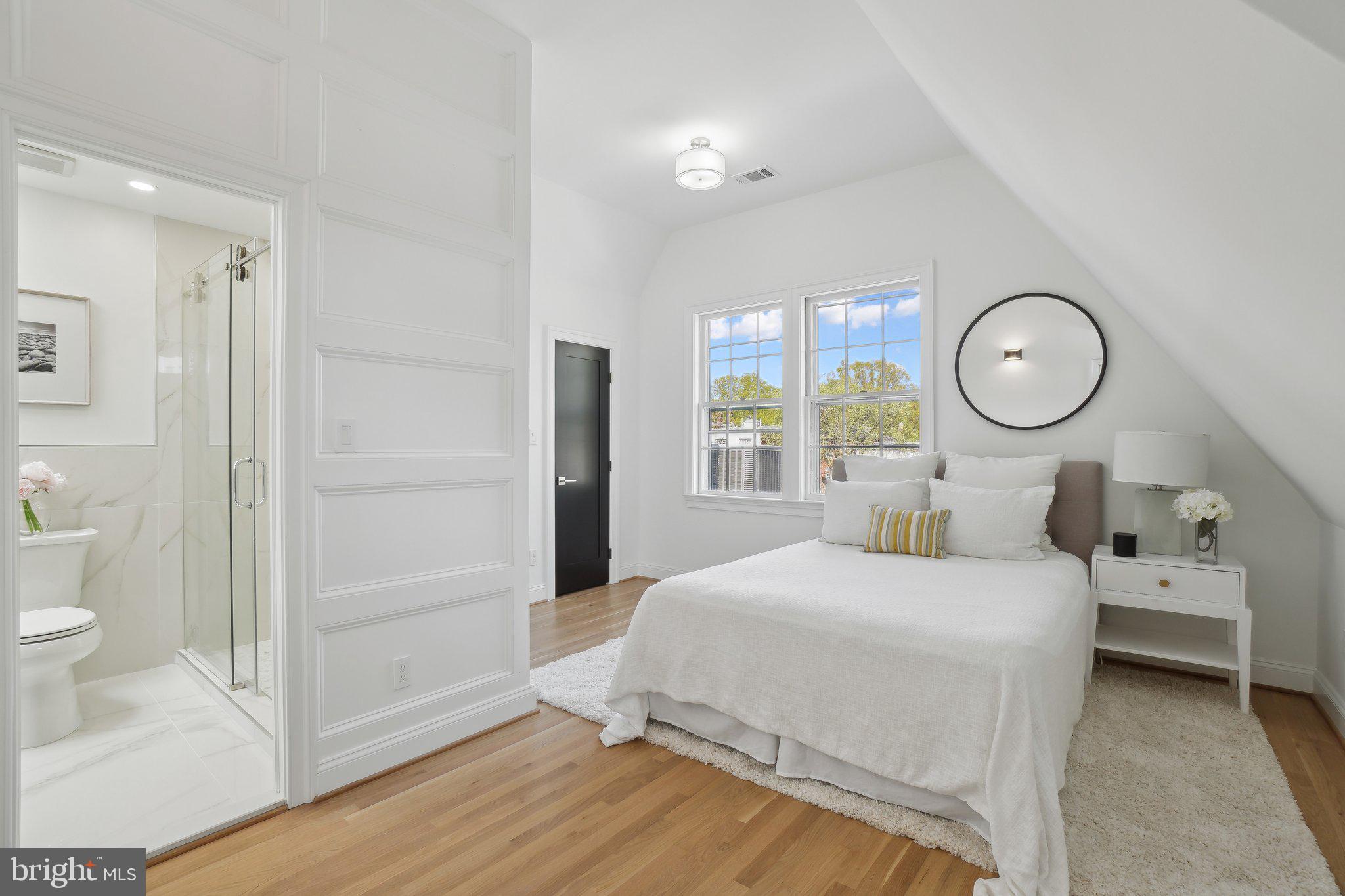 4423 Volta Place Northwest Washington, DC 20007 - Photo 22 of 36 a bedroom with a bed and a window