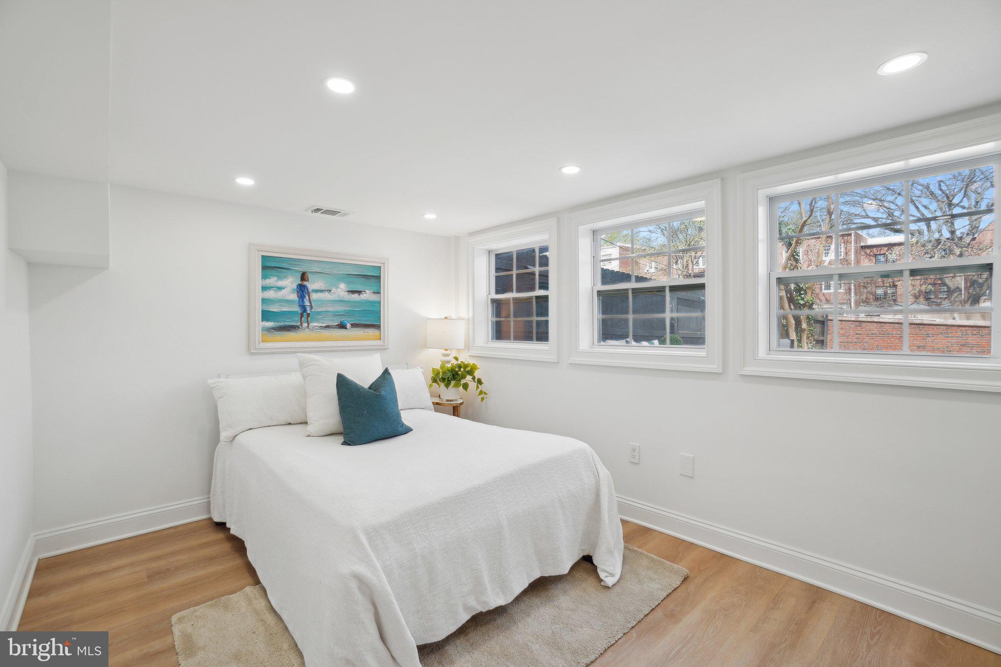 4423 Volta Place Northwest Washington, DC 20007 - Photo 27 of 36 a bedroom with a large bed and a window