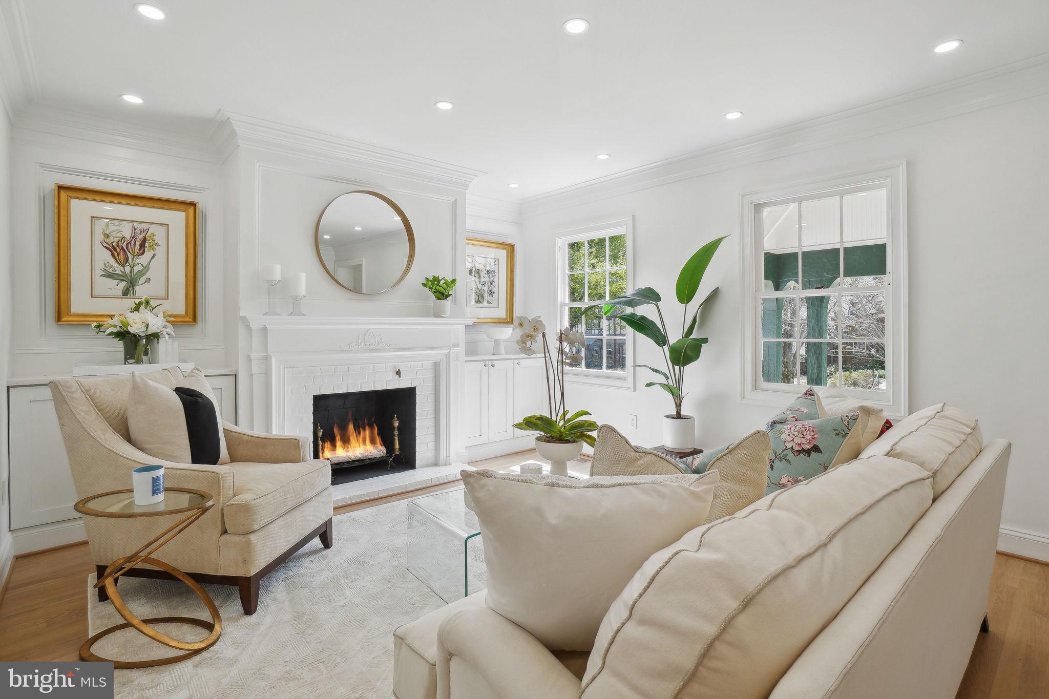 4423 Volta Place Northwest Washington, DC 20007 - Photo 3 of 36 a living room with furniture a fireplace and a large window