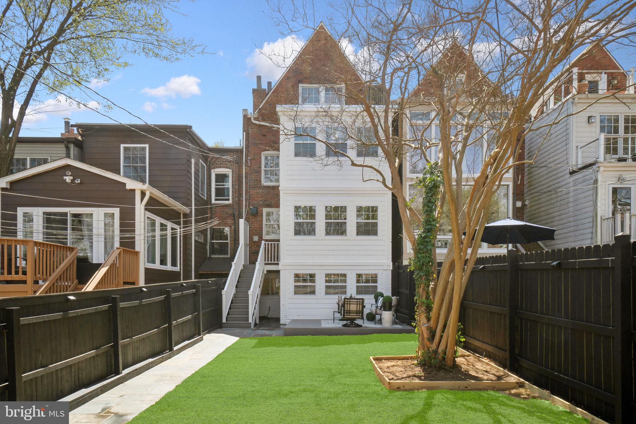 4423 Volta Place Northwest Washington, DC 20007 - Photo 31 of 36 a front view of a house with a yard