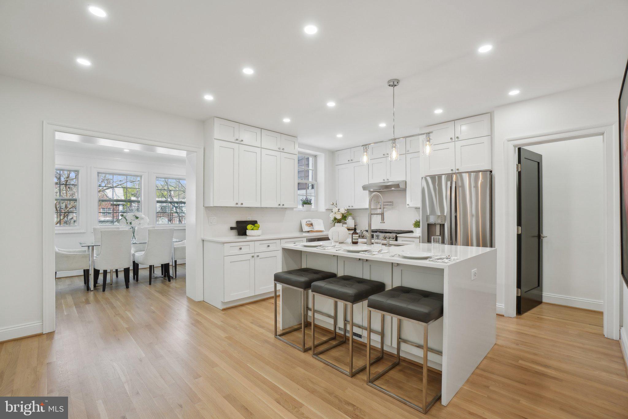 4423 Volta Place Northwest Washington, DC 20007 - Photo 6 of 36 a kitchen with appliances and wooden floor