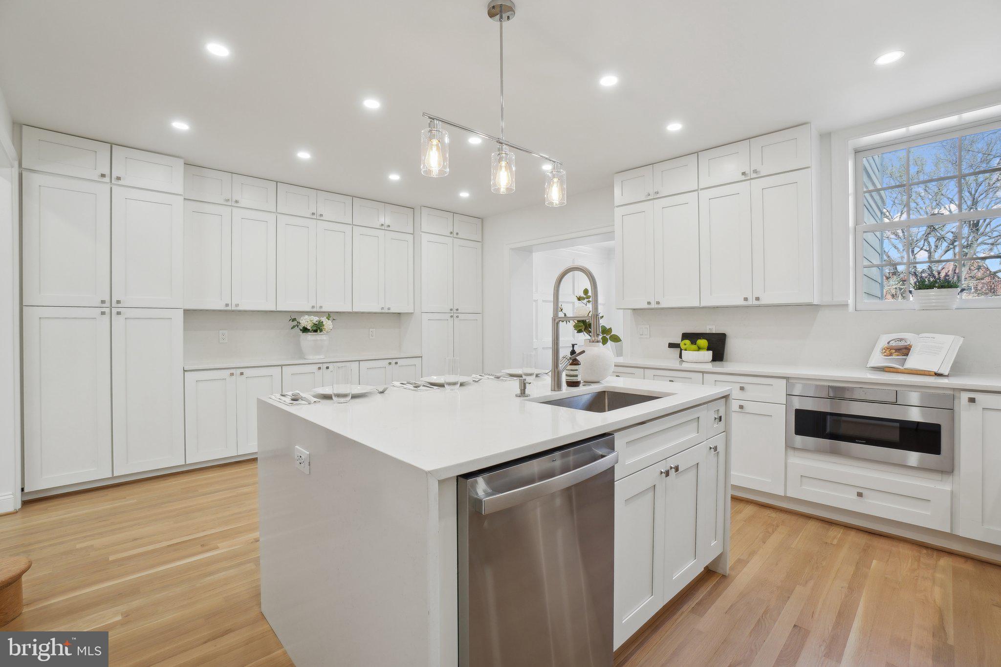 4423 Volta Place Northwest Washington, DC 20007 - Photo 9 of 36 a kitchen with a sink window and cabinets