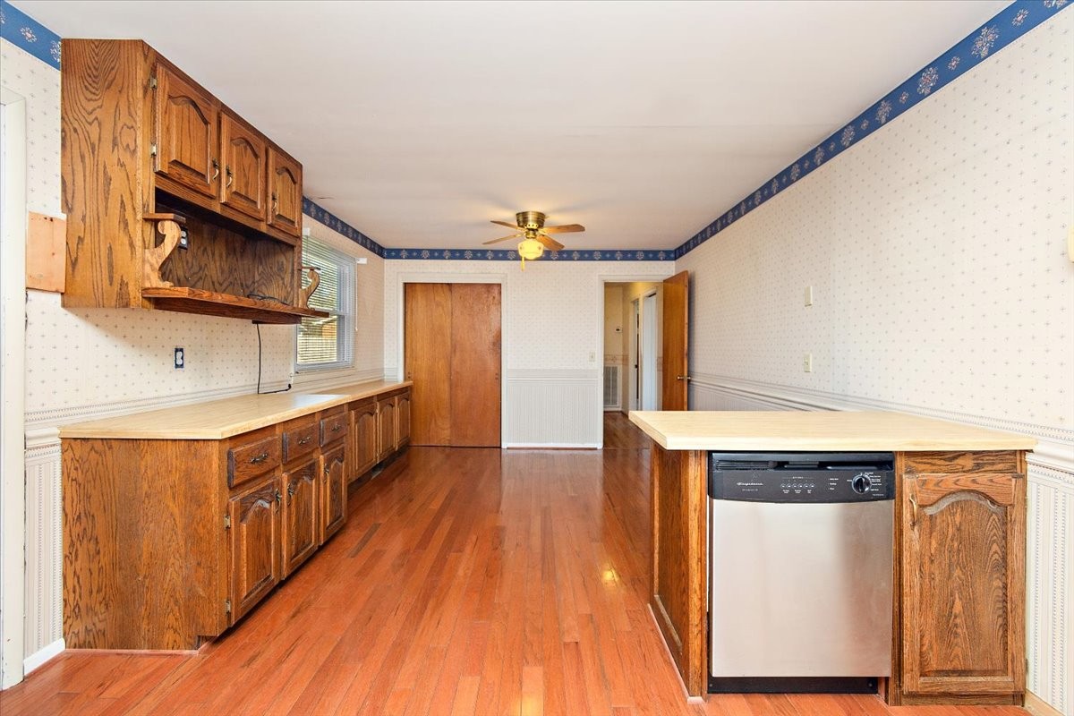 1077 Slaters Creek Road Goodlettsville, TN 37072 - Photo 11 of 29 a view of a kitchen with stainless steel appliances granite countertop a stove a sink and a refrigerator