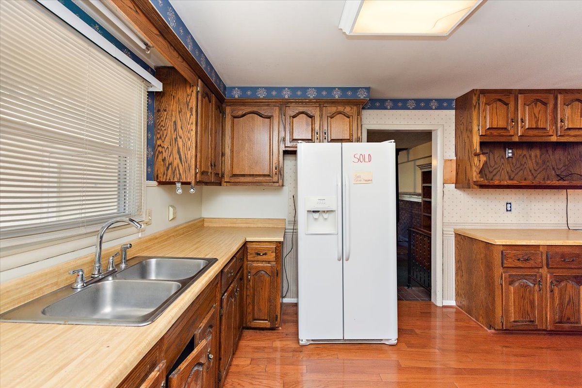 1077 Slaters Creek Road Goodlettsville, TN 37072 - Photo 13 of 29 a kitchen with stainless steel appliances granite countertop a refrigerator and a sink