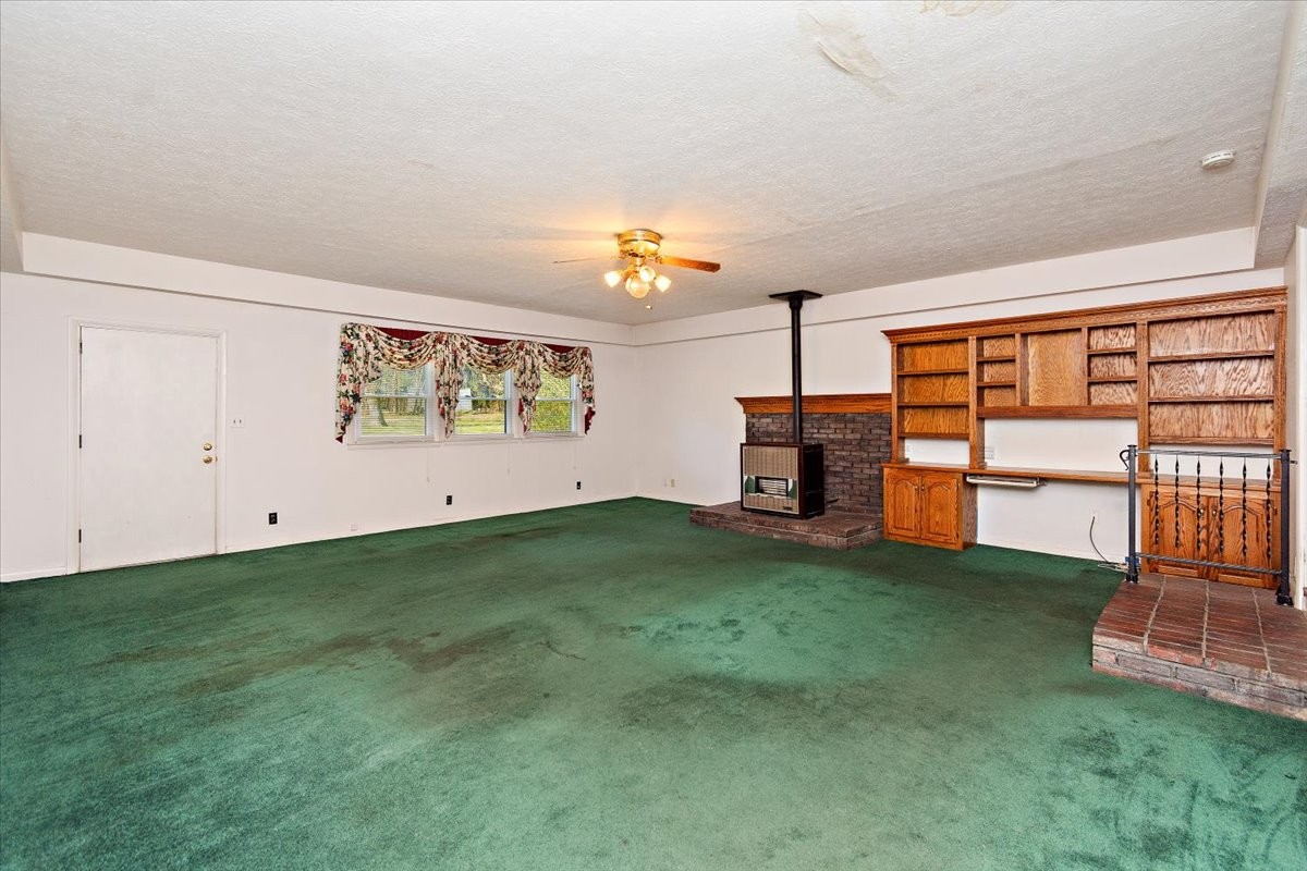 1077 Slaters Creek Road Goodlettsville, TN 37072 - Photo 14 of 29 a view of a room with furniture and a fireplace