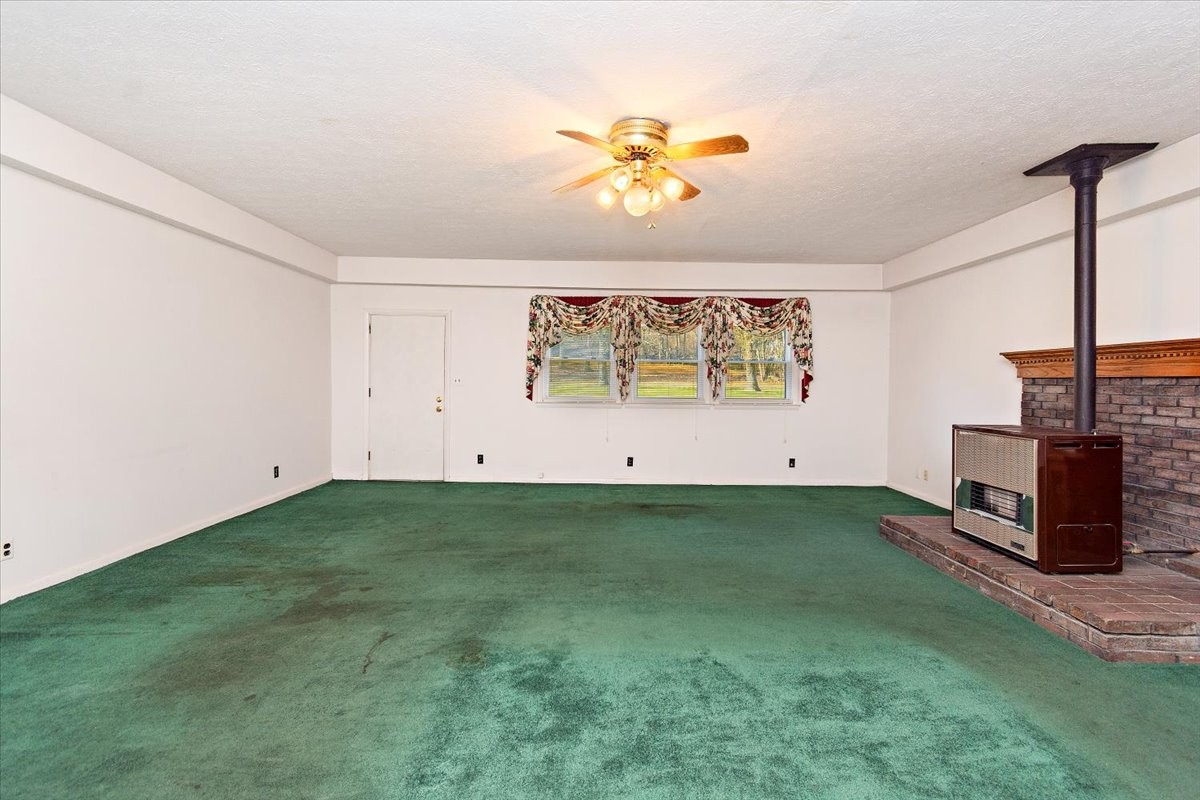 1077 Slaters Creek Road Goodlettsville, TN 37072 - Photo 15 of 29 a view of an empty room with a fireplace