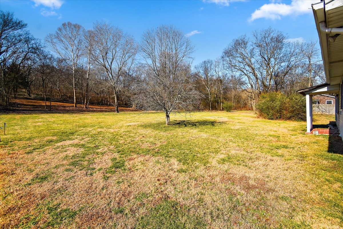 1077 Slaters Creek Road Goodlettsville, TN 37072 - Photo 23 of 29 a swimming pool with an outdoor space and seating area