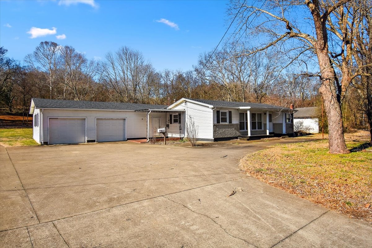 1077 Slaters Creek Road Goodlettsville, TN 37072 - Photo 29 of 29 a house with trees in front of it