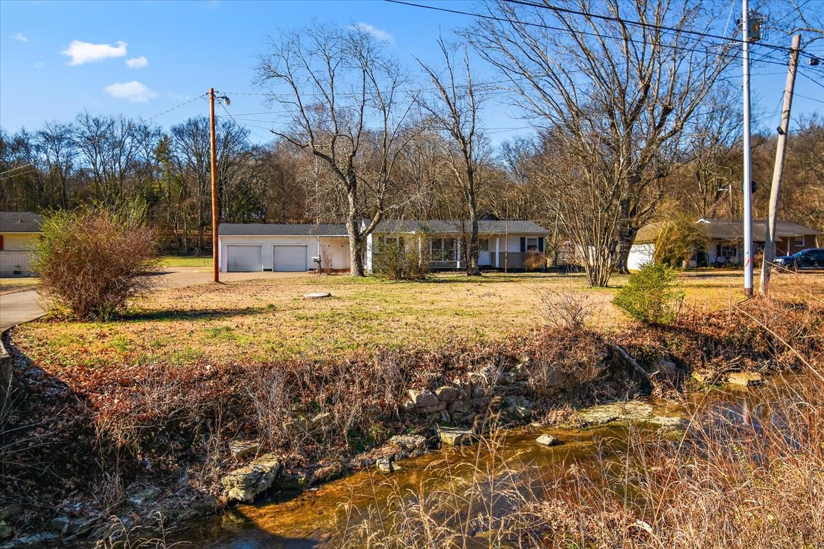 1077 Slaters Creek Road Goodlettsville, TN 37072 - Photo 5 of 29 a view of yard with tree in the background