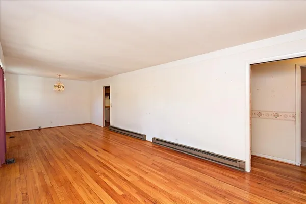 a kitchen with sink cabinets and wooden floor