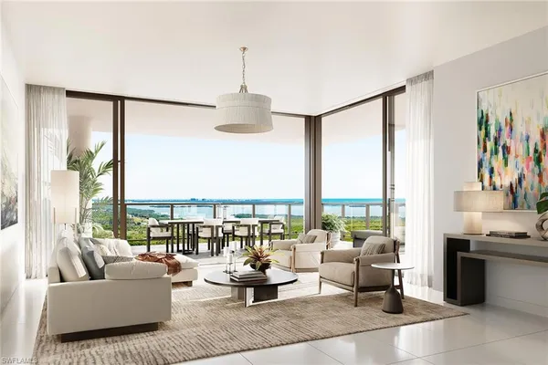 a living room with furniture and floor to ceiling windows