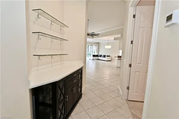 a kitchen with kitchen island a sink appliances and cabinets