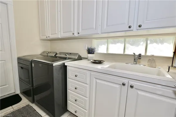 a kitchen with appliances cabinets and a window