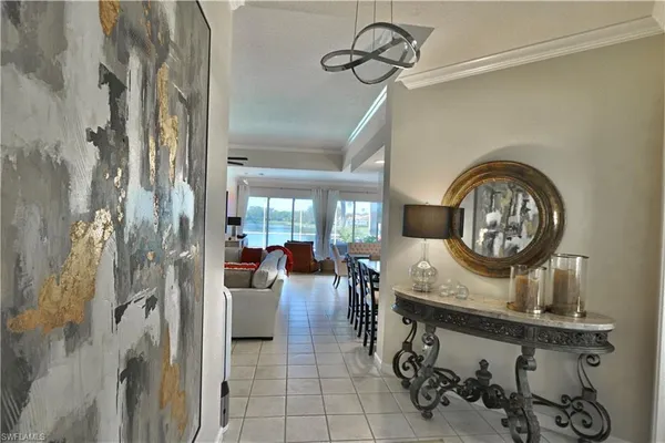 a view of a hallway with entryway dining table and chairs
