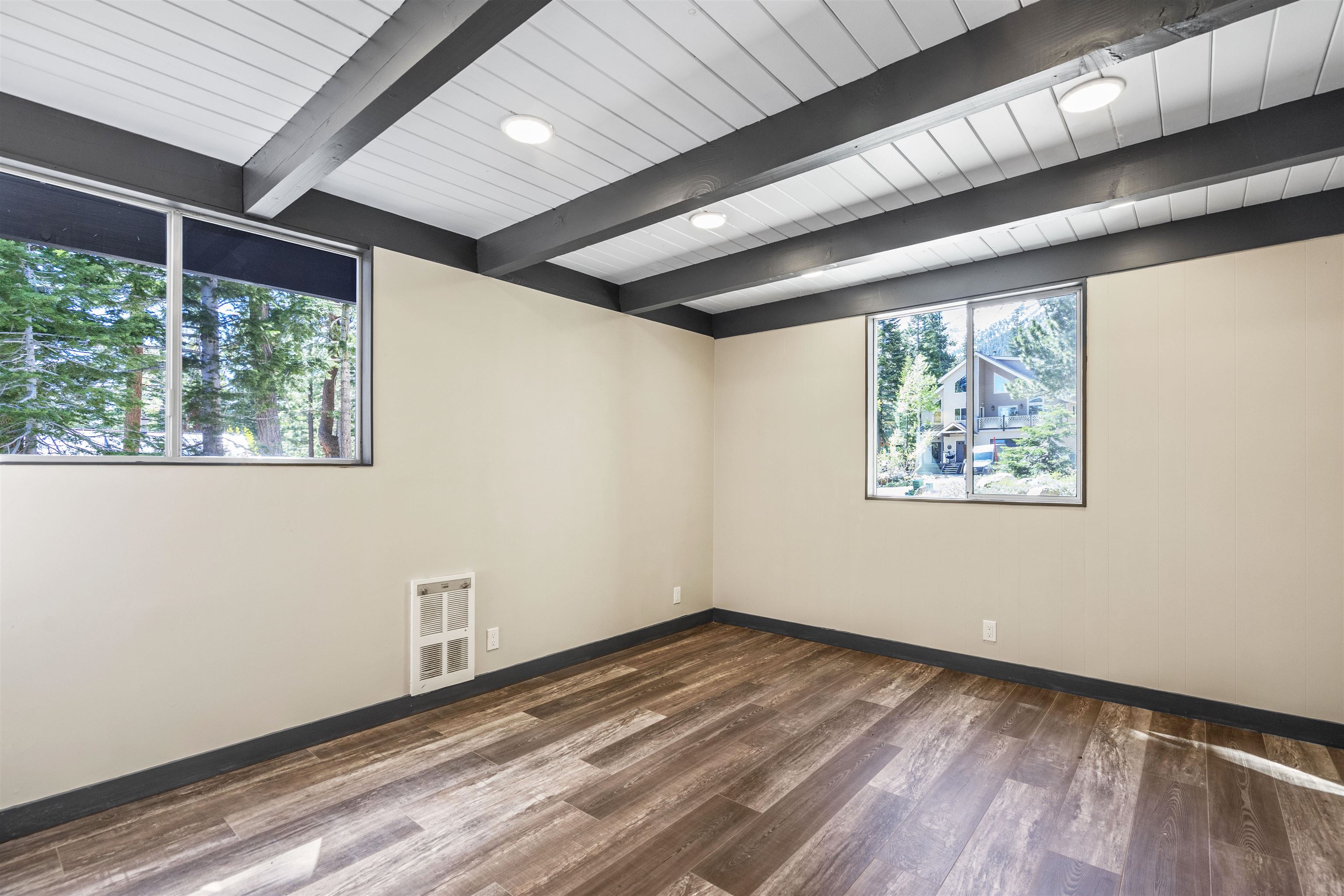 2570 Old Mammoth Road Mammoth Lakes, CA 93546 - Photo 22 of 39 Room featuring exposed wood beams, planked ceiling with recessed lighting, and wood-finish flooring