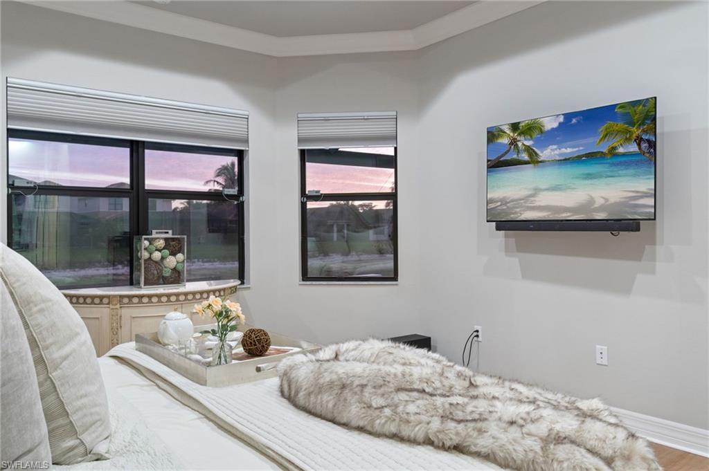 4318 Aurora Street Naples, FL 34119 - Photo 23 of 50 Bedroom featuring crown molding