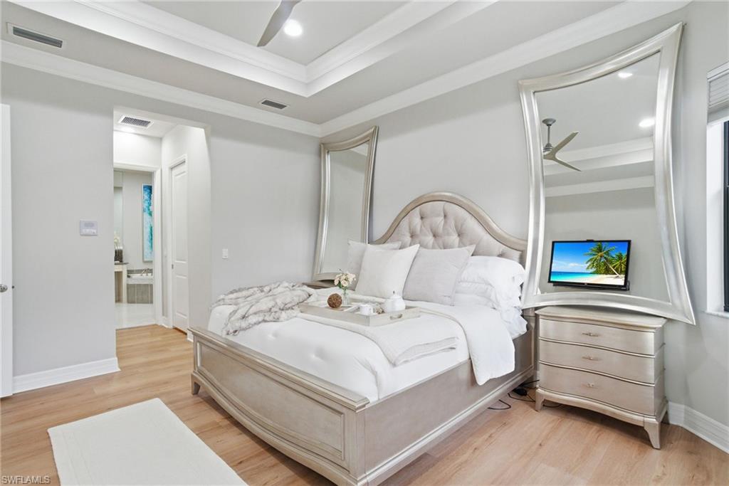 4318 Aurora Street Naples, FL 34119 - Photo 24 of 50 Bedroom featuring light wood-style floors, ceiling fan, crown molding, and recessed lighting