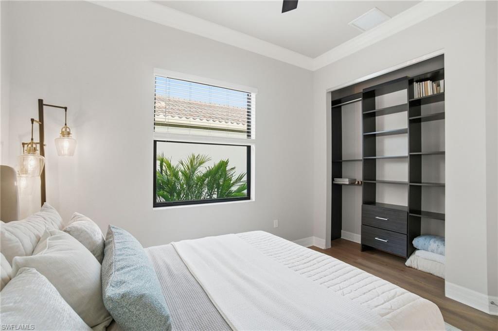 4318 Aurora Street Naples, FL 34119 - Photo 31 of 50 Bedroom featuring wood finished floors and ceiling fan
