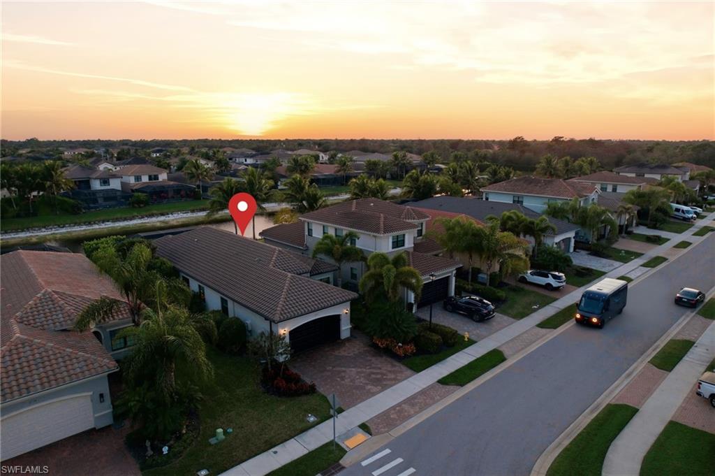 4318 Aurora Street Naples, FL 34119 - Photo 41 of 50 Aerial view at dusk of a residential view