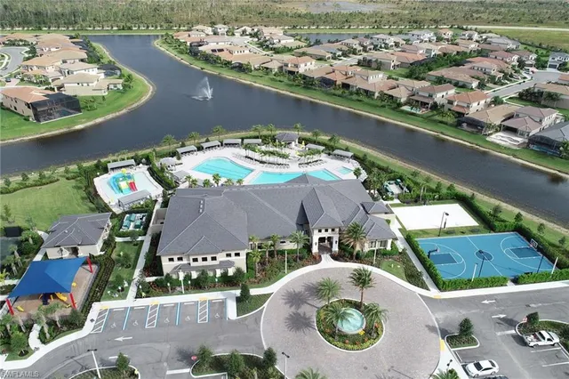 an aerial view of a house with a lake view