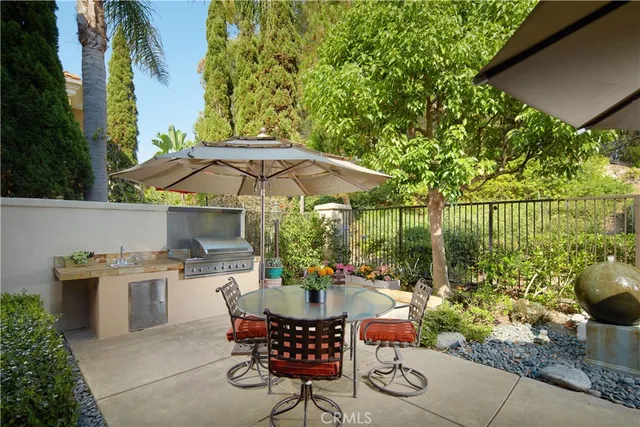a patio with tables and chairs
