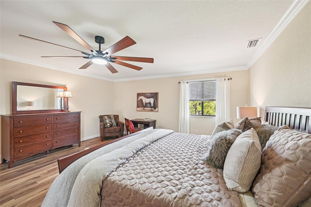 12680 Richezza Drive Venice, FL 34293 - Photo 26 of 57 a bedroom with a large bed and a window