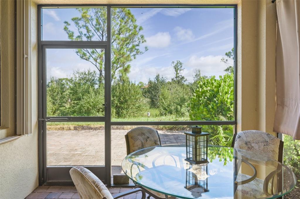 12680 Richezza Drive Venice, FL 34293 - Photo 33 of 57 a view of a chair and table in the balcony