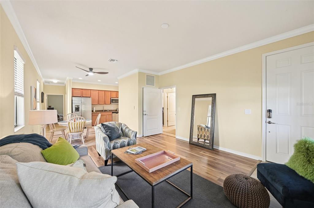 12680 Richezza Drive Venice, FL 34293 - Photo 36 of 57 a living room with furniture and a large window