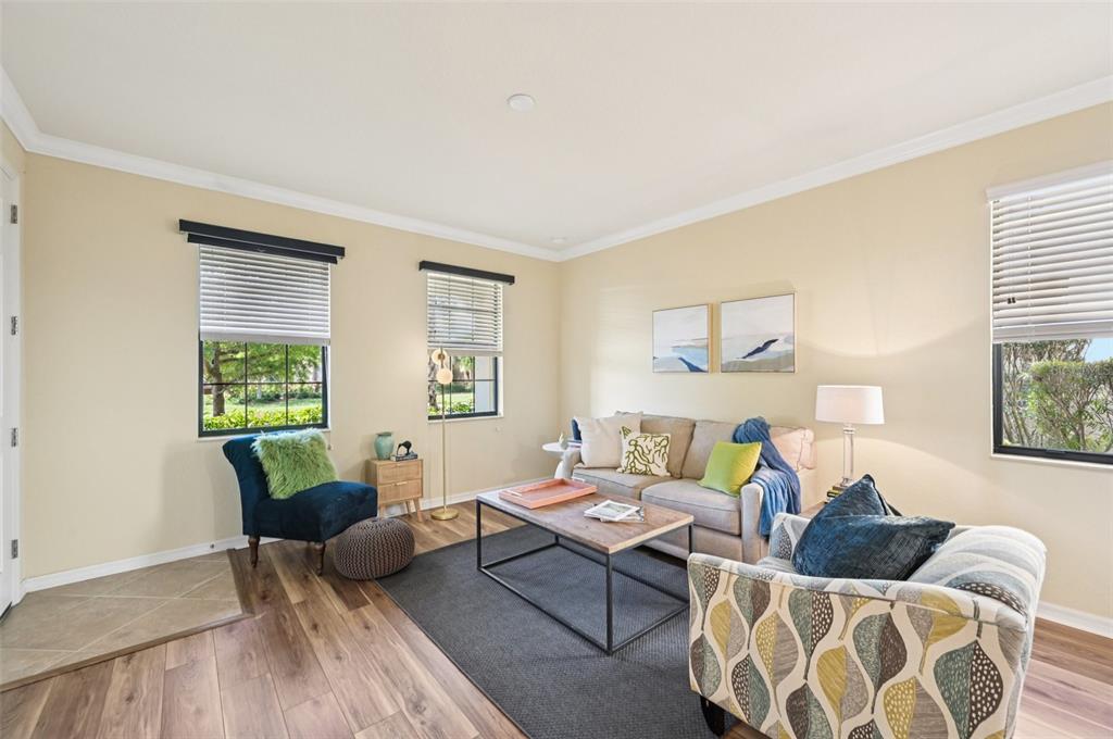 12680 Richezza Drive Venice, FL 34293 - Photo 37 of 57 a living room with furniture and a window