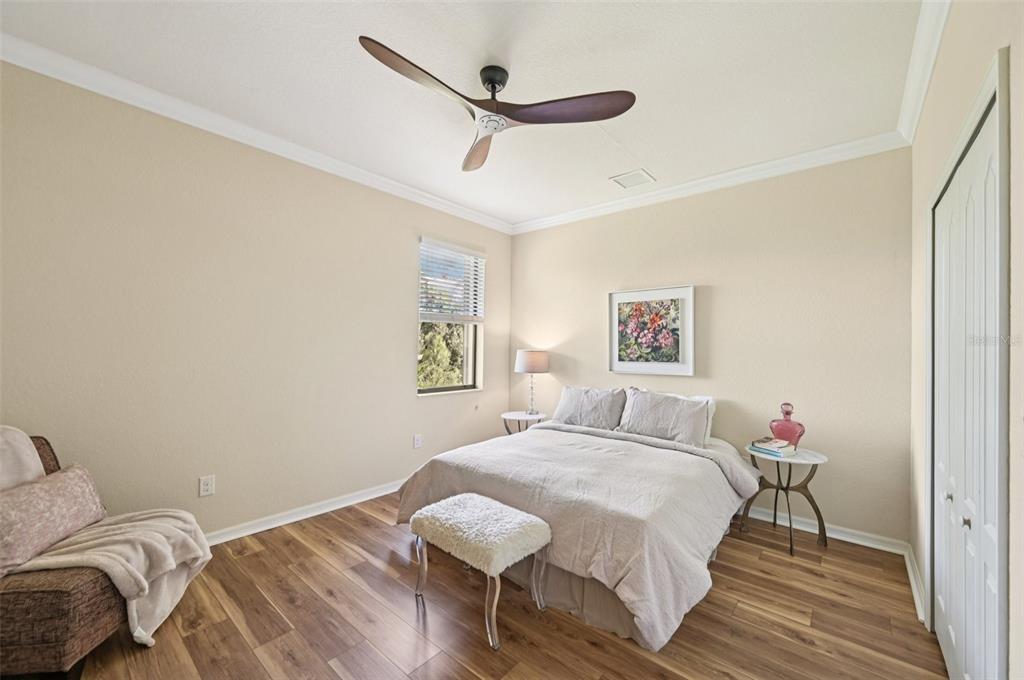 12680 Richezza Drive Venice, FL 34293 - Photo 42 of 57 a bed room with a bed and a ceiling fan