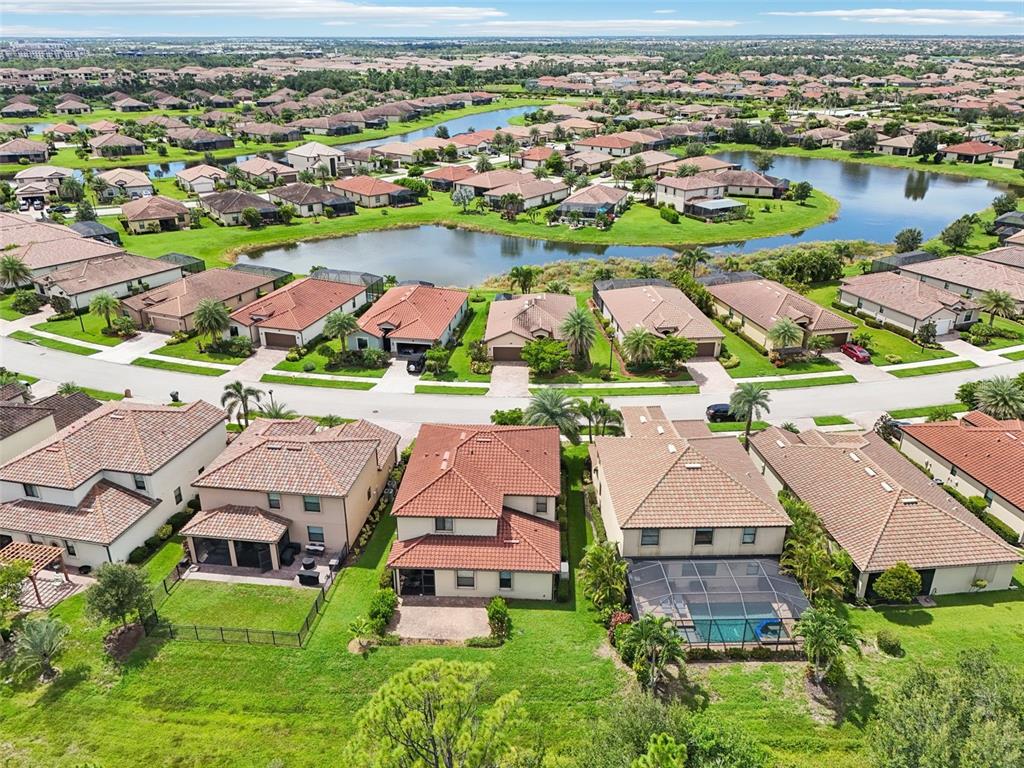 12680 Richezza Drive Venice, FL 34293 - Photo 46 of 57 an aerial view of residential houses with outdoor space