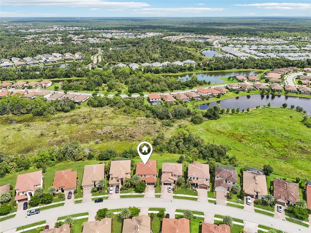 12680 Richezza Drive Venice, FL 34293 - Photo 47 of 57 an aerial view of residential houses with outdoor space and swimming pool