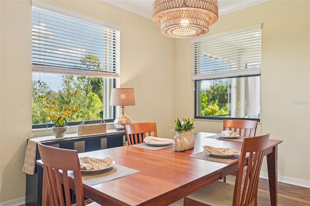 12680 Richezza Drive Venice, FL 34293 - Photo 7 of 57 a view of a dining room with furniture window and outside view