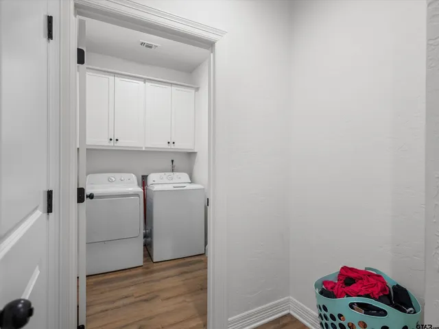 a storage room with washer and dryer