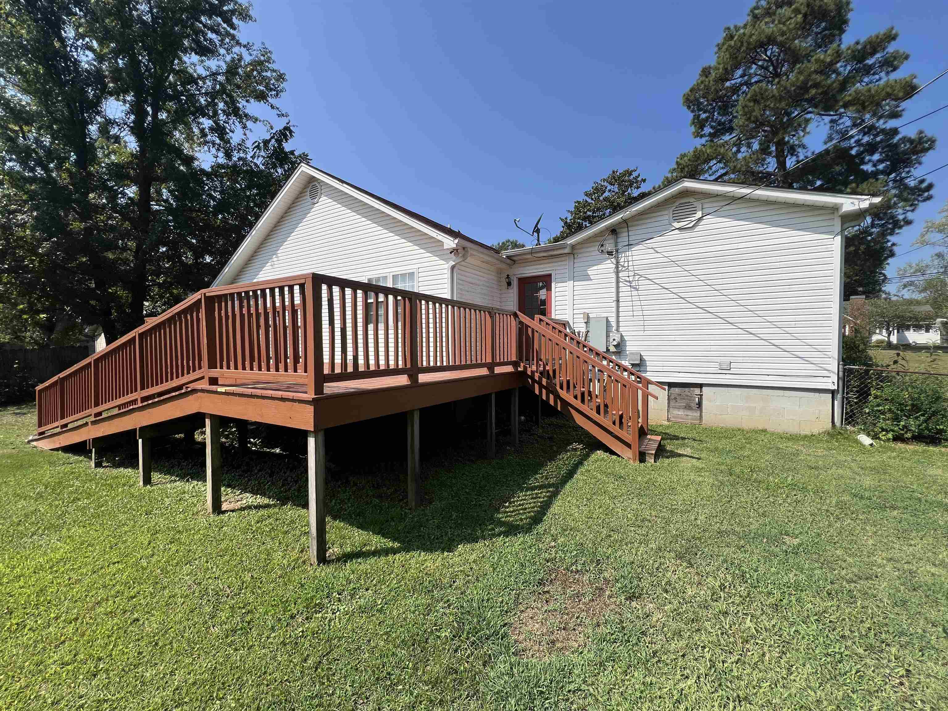 300 Patterson Road Savannah, TN 38372 - Photo 18 of 30 a front view of a house with a yard and deck