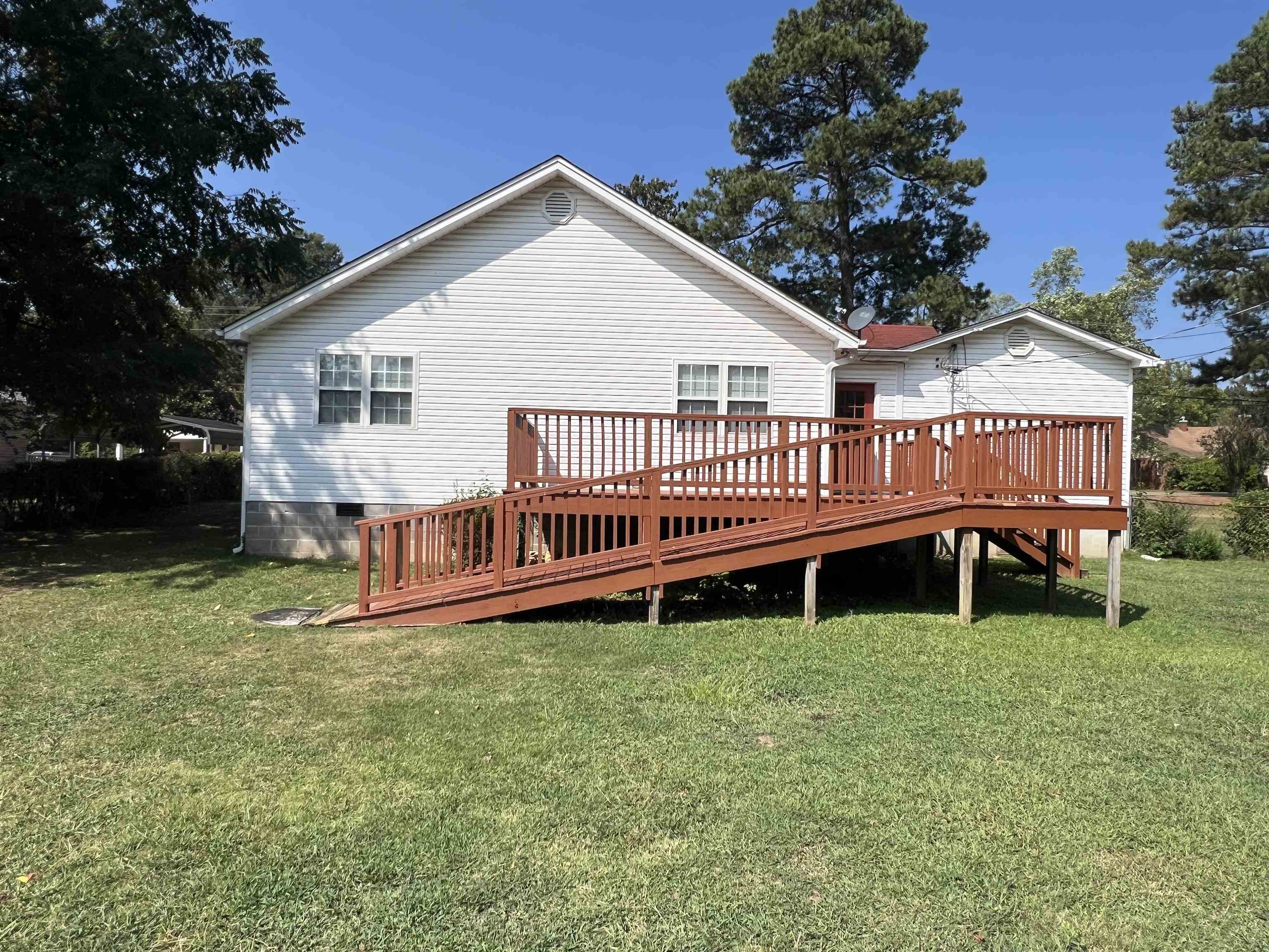 300 Patterson Road Savannah, TN 38372 - Photo 19 of 30 a view of a house with a yard and deck
