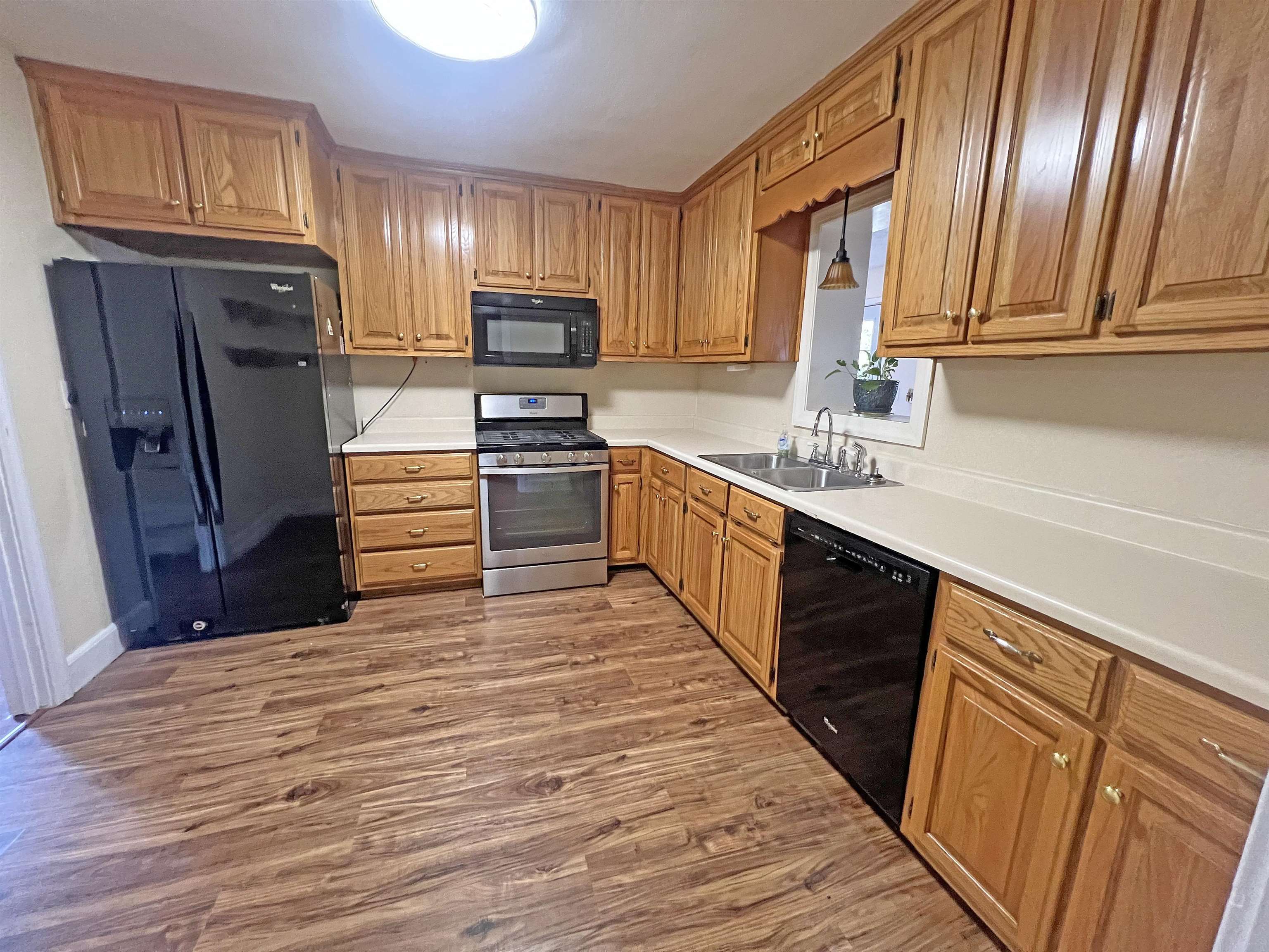 300 Patterson Road Savannah, TN 38372 - Photo 2 of 30 a kitchen with stainless steel appliances granite countertop a refrigerator sink and cabinets