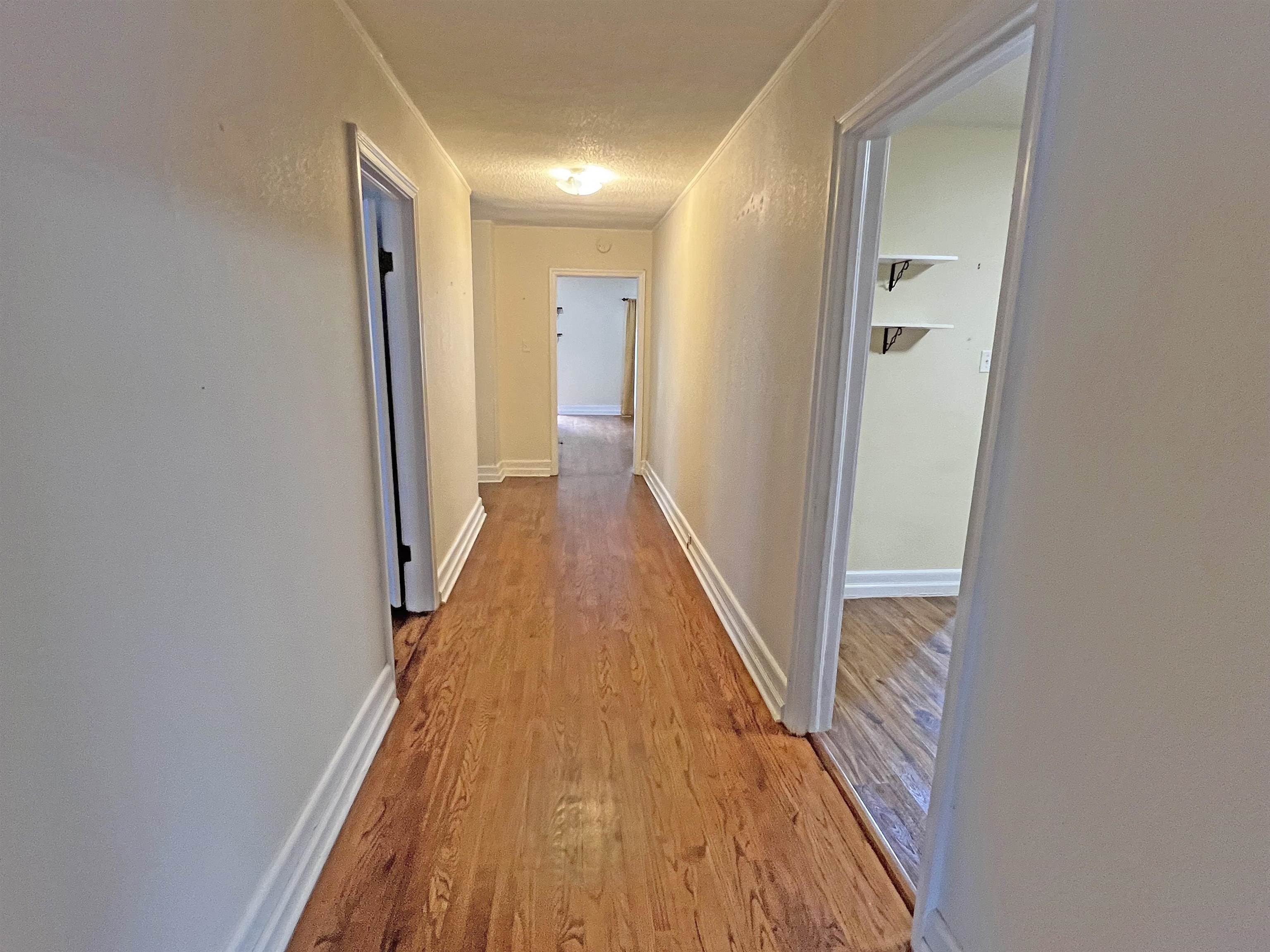 300 Patterson Road Savannah, TN 38372 - Photo 9 of 30 a view of hallway with wooden floor