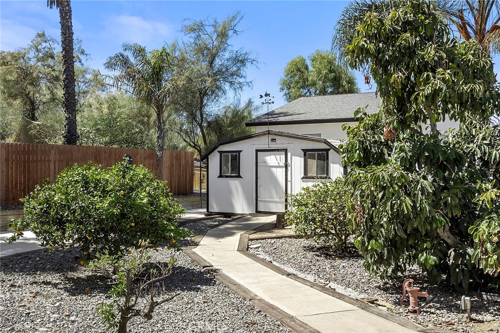 17411 Kaison Circle Riverside, CA 92508 - Photo 46 of 75 The walkway to the shed winds between mature plants and is adjacent to the koi pond