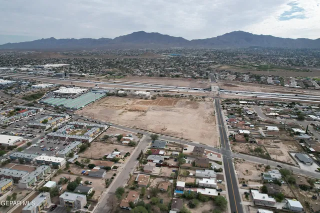 an aerial view of residential house and sandy dunes