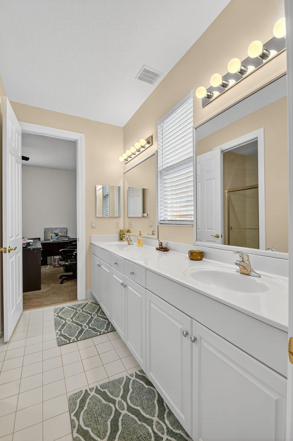 8797 Cobblestone Point Circle Boynton Beach, FL 33472 - Photo 31 of 67 a spacious bathroom with a double vanity sink a mirror and a
