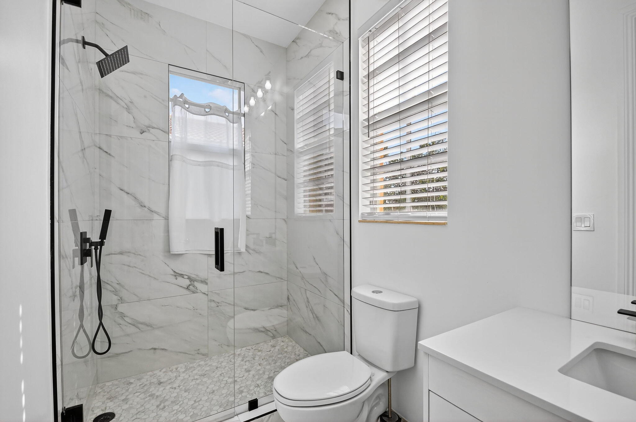 8797 Cobblestone Point Circle Boynton Beach, FL 33472 - Photo 38 of 67 a bathroom with a sink toilet and shower