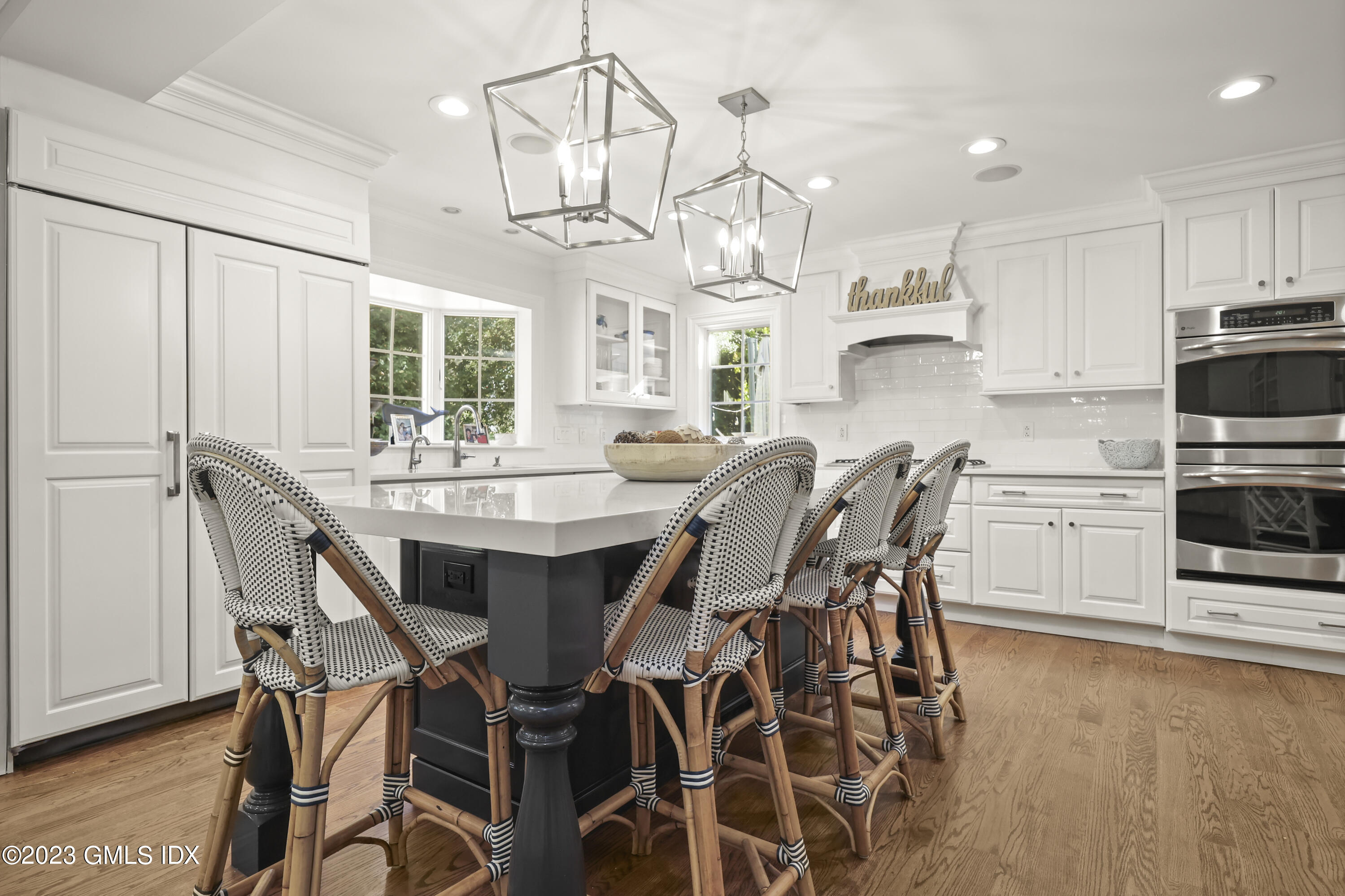 14 Rainbow Drive Riverside, CT 06878 - Photo 6 of 29 a view of a dining room with furniture a chandelier and wooden floor