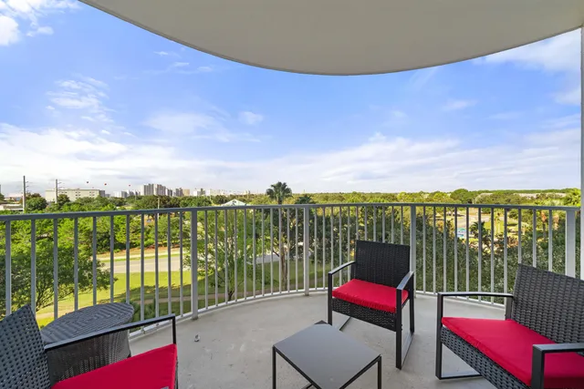 a bathroom with a granite countertop shower a toilet and a shower