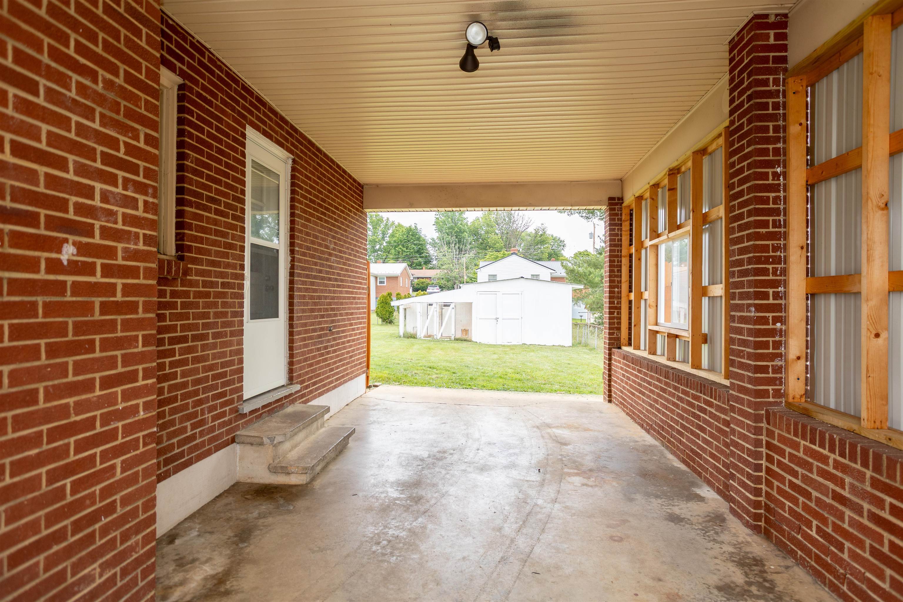 211 George Street Staunton, VA 24401 - Photo 37 of 37 a view of a porch with wooden floor and fence