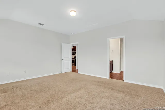 a view of an empty room with a closet