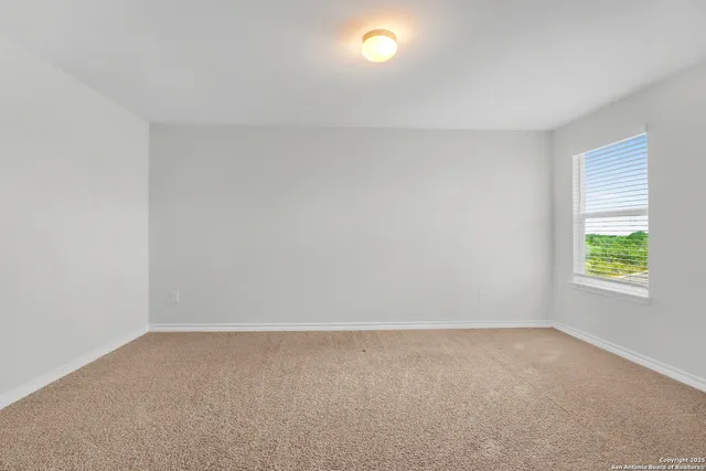 a view of room with window and stairs