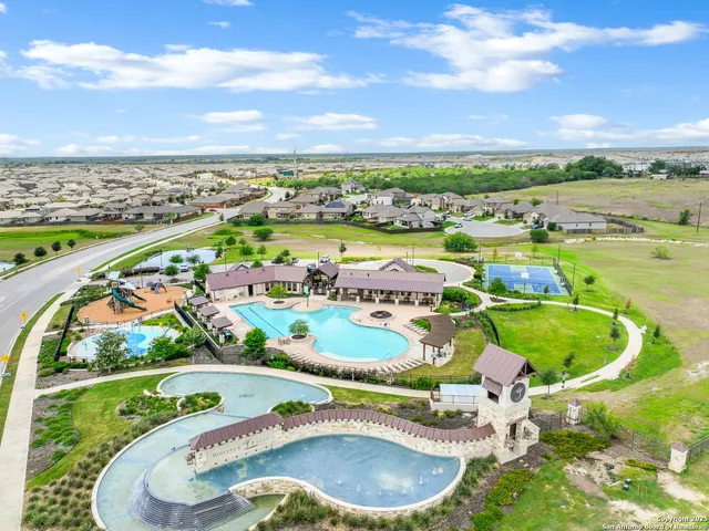 an aerial view of a swimming pool and outdoor space