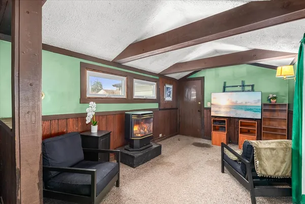 a room with furniture and a fireplace